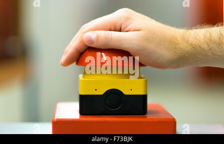 Hand pressing red buzzer Stock Photo