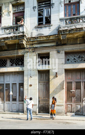 A woman pulls up a bag in Havana, Cuba. Stock Photo