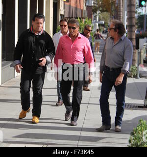 Sylvester Stallone talking a stroll with Chuck Zito and his brother Frank in Beverly Hills. Stallone stops to pose for selfies with fans in the street.  Featuring: Sylvester Stallone, Chuck Zito, Frank Stallone Where: Beverly Hills, California, United Sta Stock Photo