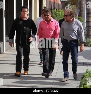 Sylvester Stallone talking a stroll with Chuck Zito and his brother Frank in Beverly Hills. Stallone stops to pose for selfies with fans in the street.  Featuring: Sylvester Stallone, Chuck Zito Where: Beverly Hills, California, United States When: 25 Oct Stock Photo