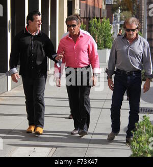 Sylvester Stallone talking a stroll with Chuck Zito and his brother Frank in Beverly Hills. Stallone stops to pose for selfies with fans in the street.  Featuring: Sylvester Stallone, Chuck Zito Where: Beverly Hills, California, United States When: 25 Oct Stock Photo