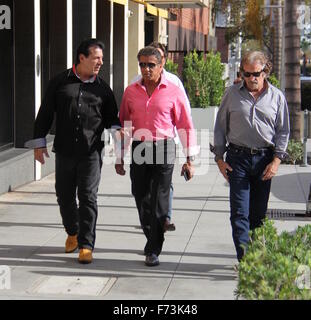 Sylvester Stallone talking a stroll with Chuck Zito and his brother Frank in Beverly Hills. Stallone stops to pose for selfies with fans in the street.  Featuring: Sylvester Stallone, Chuck Zito Where: Beverly Hills, California, United States When: 25 Oct Stock Photo