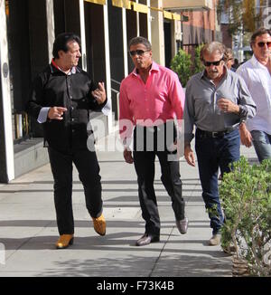 Sylvester Stallone talking a stroll with Chuck Zito and his brother Frank in Beverly Hills. Stallone stops to pose for selfies with fans in the street.  Featuring: Sylvester Stallone, Chuck Zito, Frank Stallone Where: Beverly Hills, California, United Sta Stock Photo