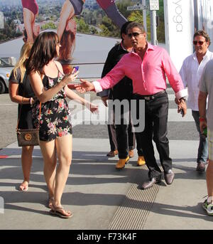 Sylvester Stallone talking a stroll with Chuck Zito and his brother Frank in Beverly Hills. Stallone stops to pose for selfies with fans in the street.  Featuring: Sylvester Stallone, Frank Stallone Where: Beverly Hills, California, United States When: 24 Stock Photo