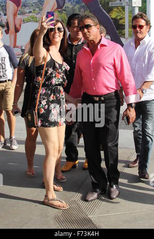 Sylvester Stallone talking a stroll with Chuck Zito and his brother Frank in Beverly Hills. Stallone stops to pose for selfies with fans in the street.  Featuring: Sylvester Stallone, Frank Stallone Where: Beverly Hills, California, United States When: 24 Stock Photo