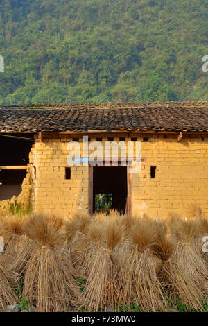 Rice Straw Bales and Rice Store Building Guilin Region Guangxi, China LA007998 Stock Photo