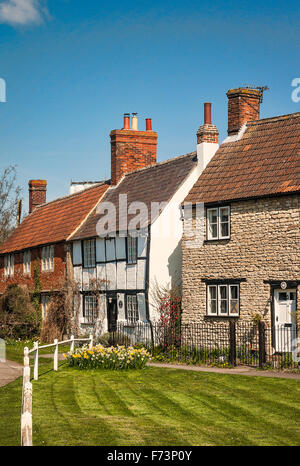 Old cottages by the Green in Steeple Ashton Wiltshire UK Stock Photo