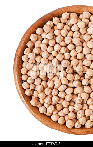 Uncooked chickpeas in wooden bowl on white background Stock Photo