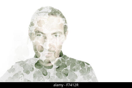 Portrait of young man combined with natural green wild clover leaves background, double exposure photo effect Stock Photo