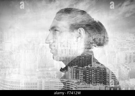 Profile portrait of young man combined with modern cityscape under cloudy sky, double exposure photo effect Stock Photo
