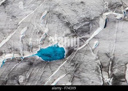 The Aletsch Glacier. Aletschgletscher. Blue water of glacial surface lake. Eastern Bernese Alps in the Swiss canton of Valais. Switzerland. Stock Photo