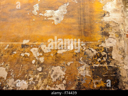 peeling paint on an old wall on a building in Florence street ,Tuscany ,Italy Stock Photo