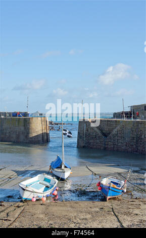 Saint Piran's Cross, the Flag of Cornwall flying from a boat in St Ives harbour, Cornwall Stock Photo