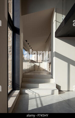 Sunlit corridor and hallway with steps in  House, Jaffa, Tel Aviv, Israel Stock Photo