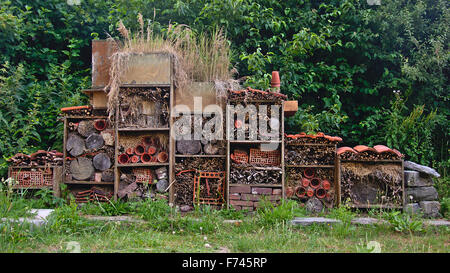 Insect hotel with recycled wood, terracota flower pots and roof tiles, found at bourgoyen, Ghent, Belgium Stock Photo