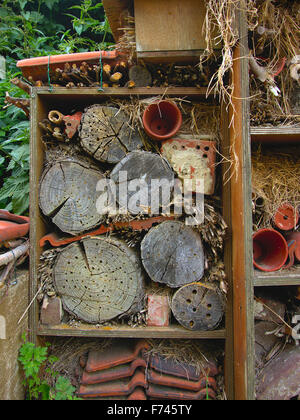 Detail of Insect hotel with recycled wood, terracotta flower pots and roof tiles, found at bourgoyen, Ghent, Belgium Stock Photo