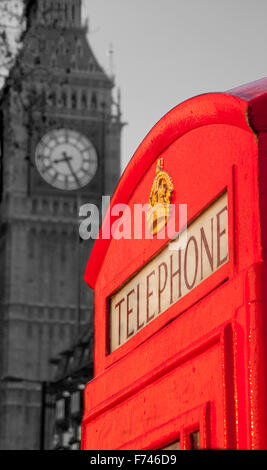 Traditional red K6 telephone phone box with Big Ben Elizabeth Tower of Houses of Parliament black and white monochrome London UK Stock Photo