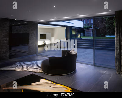 Night shot between the lounges in Holland Park House by Paul Archer Design, London, England, UK Stock Photo