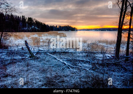 Distant skaters on thin ice Stock Photo