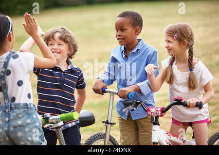 Happy Children in a team making a high five sign Stock Photo