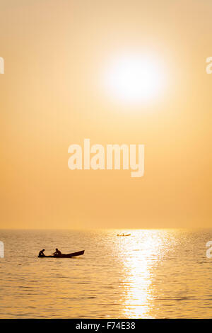 Fishermen pull in their nets at sunset on Lake Catemaco, Veracruz, Mexico. Stock Photo