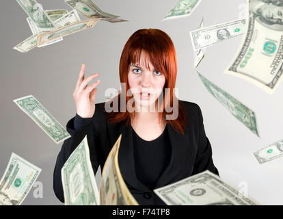 Angry girl throwing money in your face Stock Photo