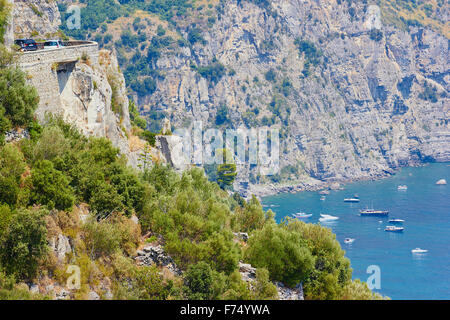 Hairpin bend on clifftop road above idyllic bay Amalfi Coast Salerno Campania Italy Europe Stock Photo