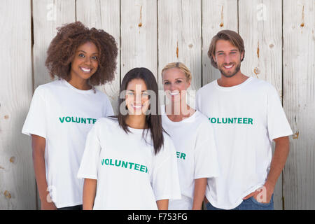 Composite image of happy group of volunteers Stock Photo