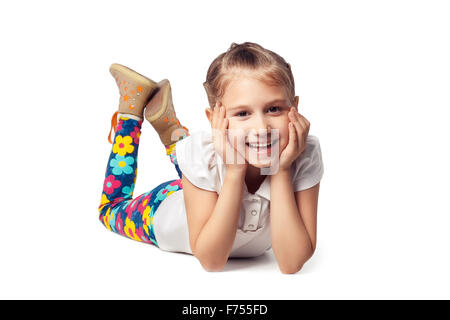 Little girl laughing, lying on his stomach. cut out Stock Photo