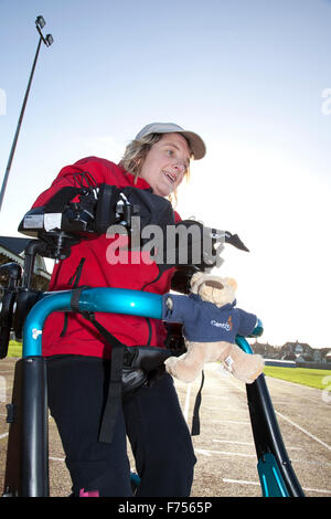 Great Yarmouth, UK. 25th November 2015. Great Yarmouth woman Lisa Borrett, who has cerebral palsy, defeats medical sceptics by learning to walk after a life in a wheelchair. Completing the longest walk of her life and her first outdoors to raise money for local charity Centre 81 and her own enterprise Life Takes Two, 34 year old Lisa even manages a lap of honour around the quarter mile athletics track at the Wellesley recreation Ground in Great Yarmouth. © Adrian Buck/Alamy Live News Credit:  Adrian Buck/Alamy Live News Stock Photo