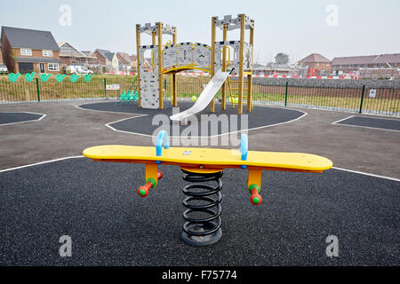 Riverside View on New Quay Road, Lancaster, in Lancashire. Same children's playground on a modern new estate   Young kids childr Stock Photo