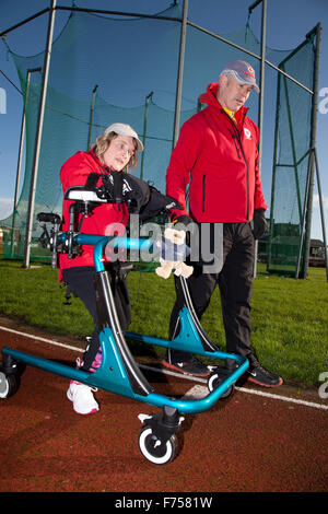 Great Yarmouth, UK. 25th November 2015. Great Yarmouth woman Lisa Borrett, who has cerebral palsy, defeats medical sceptics by learning to walk after a life in a wheelchair. Completing the longest walk of her life and her first outdoors to raise money for local charity Centre 81 and her own enterprise Life Takes Two, 34 year old Lisa even manages a lap of honour around the quarter mile athletics track at the Wellesley recreation Ground in Great Yarmouth. Credit:  Adrian Buck/Alamy Live News Stock Photo