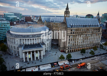 Manchester skyline showing the rooftops and central library and the town hall extension    tower light shaft rays through clouds Stock Photo