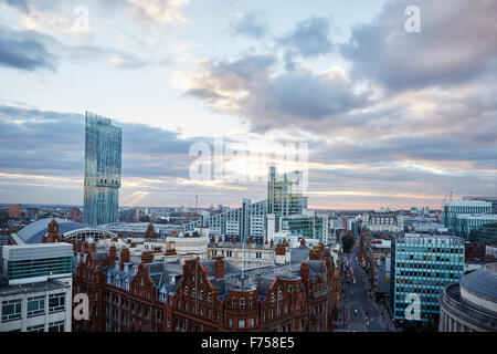 Manchester skyline showing the rooftops of games   g-mex central betham tower light shaft rays through clouds dusk dawn low ligh Stock Photo