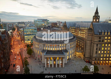 Manchester skyline showing the rooftops and central library and the town hall extension    tower light shaft rays through clouds Stock Photo