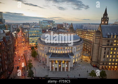 Manchester skyline showing the rooftops and central library and the town hall extension    tower light shaft rays through clouds