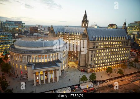 Manchester skyline showing the rooftops and central library and the town hall extension    tower light shaft rays through clouds Stock Photo
