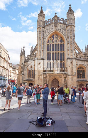 Busker in front of Bath Abbey in Bath, Somerset England United Kingdom UK Stock Photo