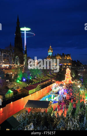 The beautiful Edinburgh German Christmas market in East Princes Street Gardens, at dusk, in Scotland, UK