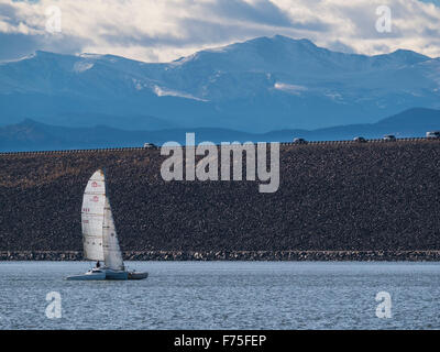 Sailboat sails Cherry Creek Reservoir, autumn, Aurora, Colorado. Stock Photo