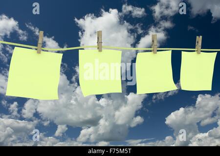 Four clean memo hanging on a cord. 3D image. Stock Photo