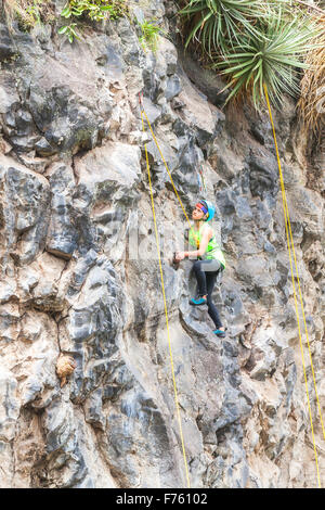 Banos, Ecuador - 30 November 2014: Basalt Challenge Of Tungurahua, Hispanic Youth Climber Performing An Exercise Climbing Rescue Stock Photo
