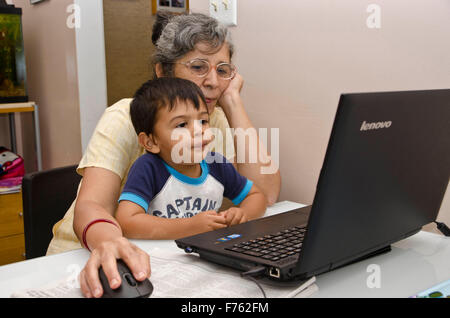 Child learning through internet with granny, edison, new york, usa, mr#447 Stock Photo