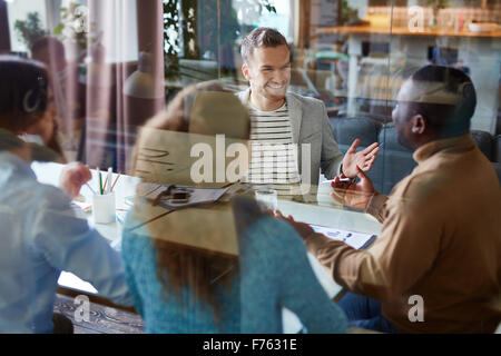 Several business partners consulting in office Stock Photo