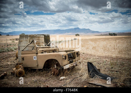 Half of a broken down Land Rover in a field in South Africa Stock Photo