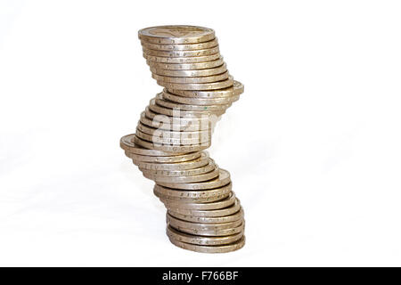 An unstable pile of two-euro coins, isolated on white Stock Photo