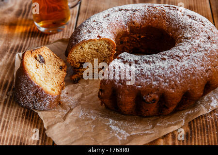 bake ring cake with icing sugar sliced Stock Photo