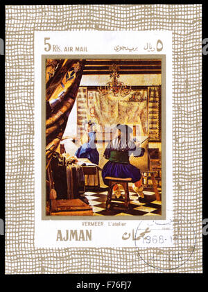 AJMAN (UAE) - CIRCA 1968: a stamp printed in Ajman (UAE) shows the picture 'The Art of Painting', painted by the famous Dutch ba Stock Photo