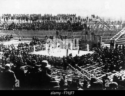 Vintage photo of the famous fight for the World Heavyweight Championship between boxers James J Corbett (1866 - 1933) and Bob Fitzsimmons (1863 - 1917). The bout, billed as the 'Fight of the Century', took place on March 17 1897 in front of around 5,000 spectators in Carson City, Nevada. Fitzsimmons, the challenger, won by KO in the 14th round after hitting champion Corbett, nicknamed 'Gentleman Jim', with his famous 'solar plexus punch'. Stock Photo