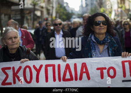 Athens, Greece. 26th November, 2015. Pensioners hold banners as they march to the Ministry of Health to protest against cuts. Pensioners staged a demonstration to protest over pension cuts and deteriorating health services. 26th Nov, 2015. Credit:  Nikolas Georgiou/ZUMA Wire/Alamy Live News Stock Photo